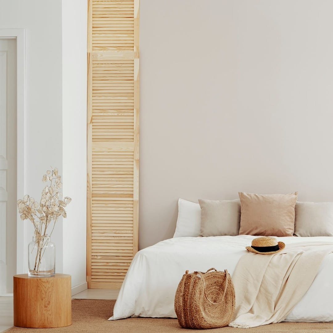 white walls and a white bed are all you really need to transform your bedroom into a summer paradise retreat.