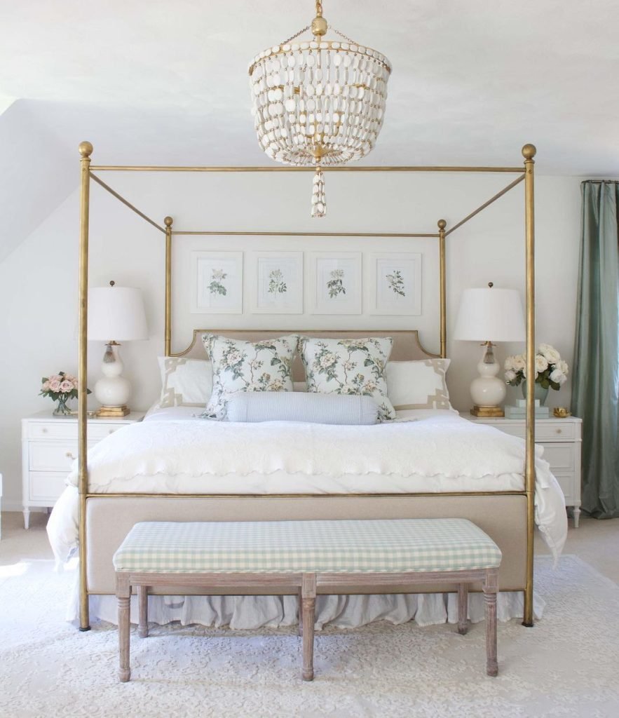 bedroom interior with a canopy bed and end bench