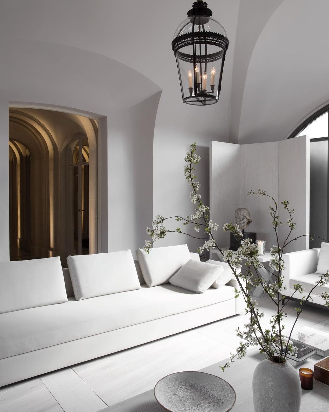 a living space with minimalist style furniture and a neutral color palette is effective in creating a serene and peaceful interior as in this example